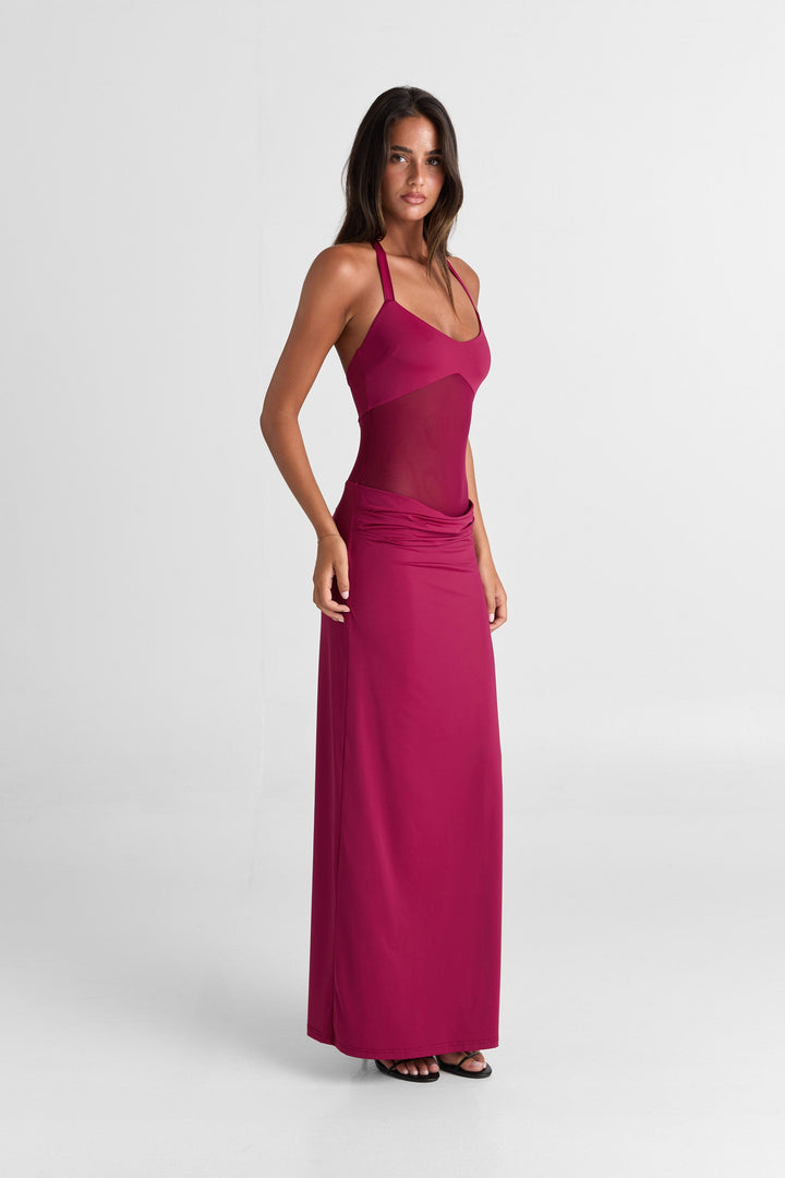 Woman wearing a pink dress on a white background