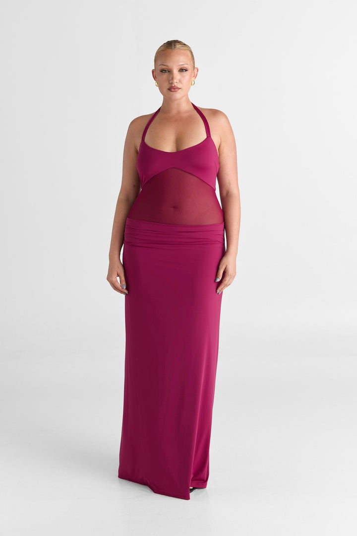 Woman wearing a pink dress on a white background