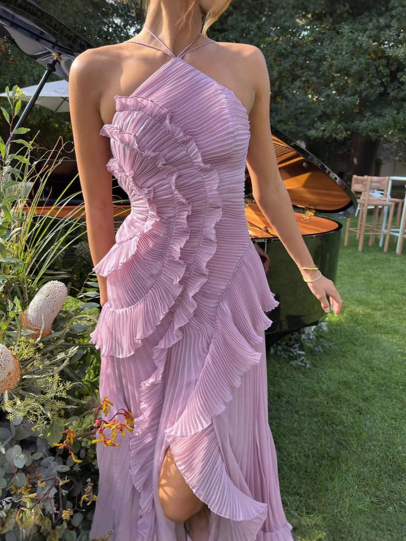 Woman wearing a pink ruffled dress in an outdoor setting